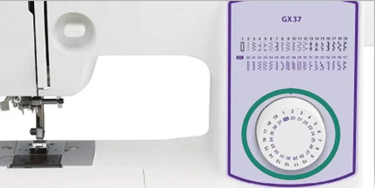 sewing machine stitch adjustment button