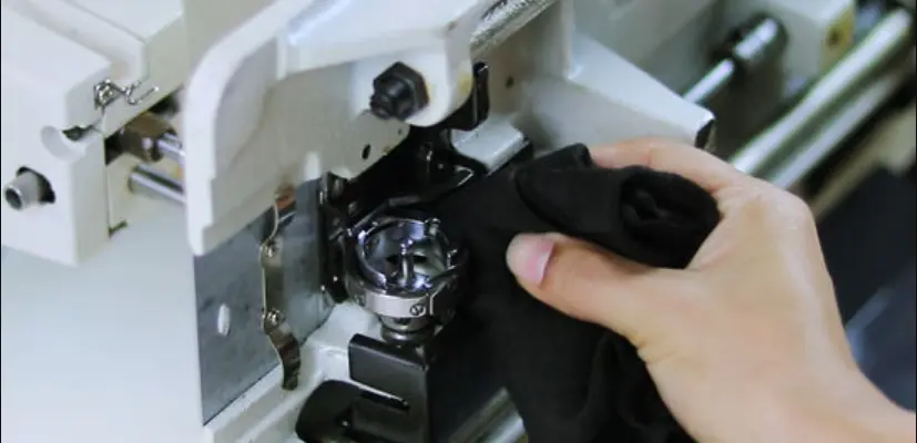 wipe away excess oil on the sewing machine