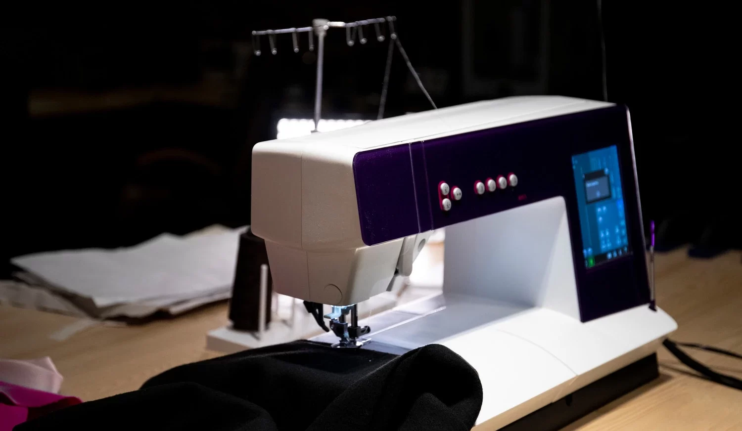 Close-up of a Computerized Quilting Machine with pros and cons listed - Computerized Quilting Machines