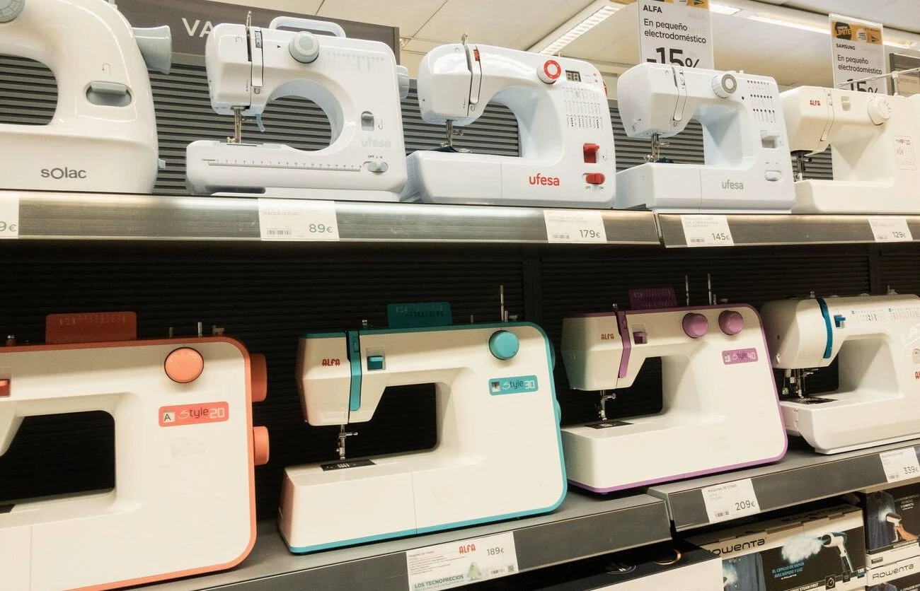 A row of sewing machines on display in a store - choose a best sewing machines