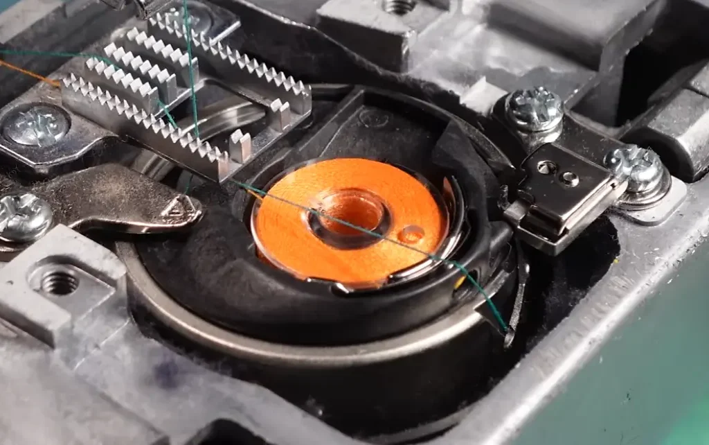 Open the bobbin compartment and place the bobbin